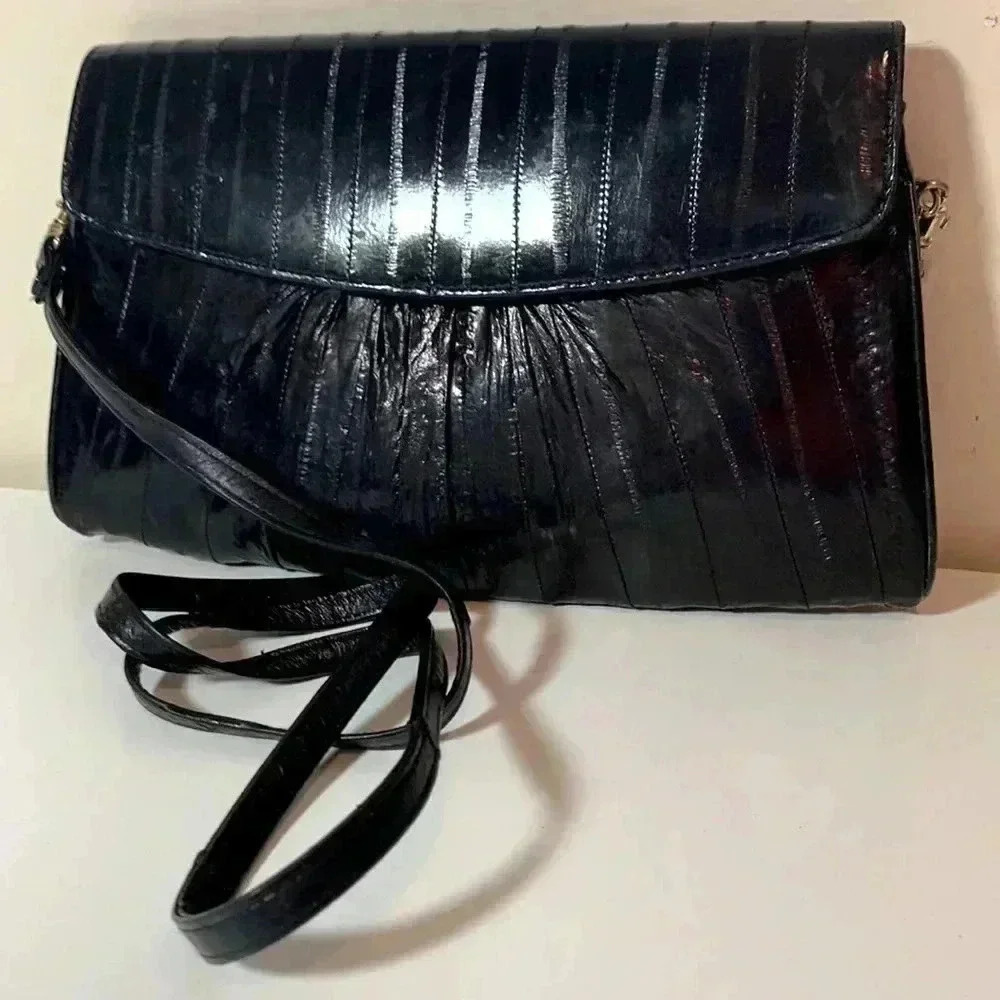 Source Unknown, 100% eel skin, black bag in very good used condition